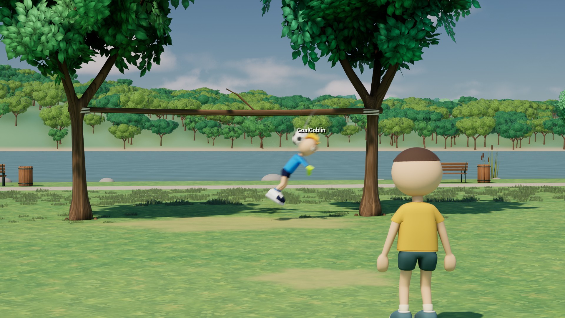The goalkeeper dives as a shot flies towards a goal between the park trees.